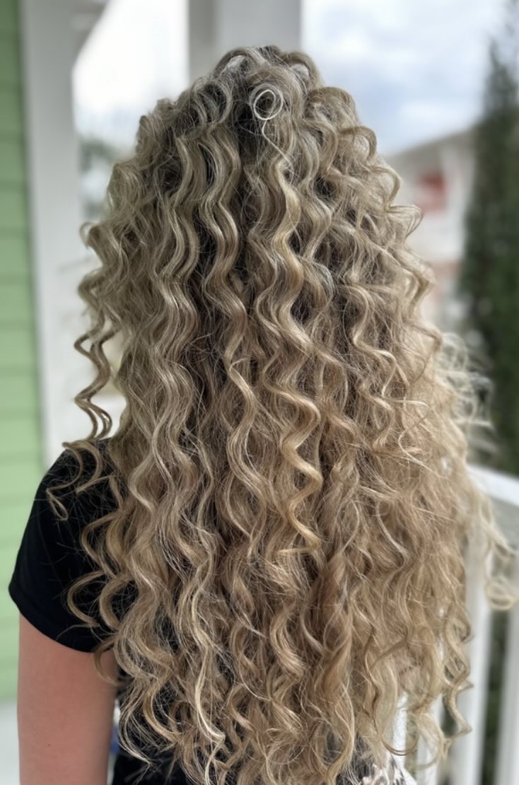 Curly blonde hair